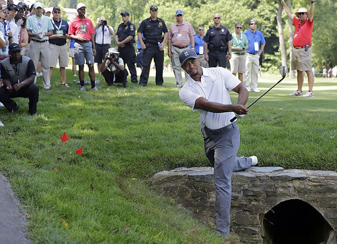 As per usual with his 2014 season, those smiles didn’t last long. Woods missed the 36-hole cut at Quicken Loans for just the 10th time in his professional career. Abnormally, Woods was in good spirits following the event, noting he was happy with how his body performed throughout the two rounds.