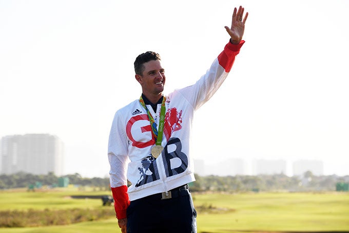 Justin Rose on the podium with his gold medal.