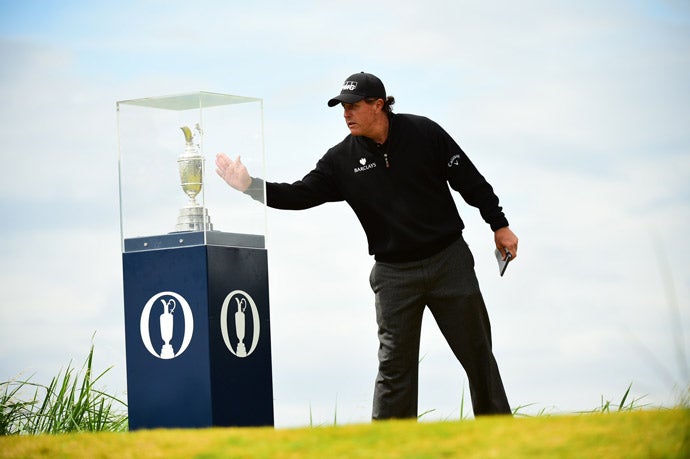 Mickelson takes a look at the claret jug before starting his final round