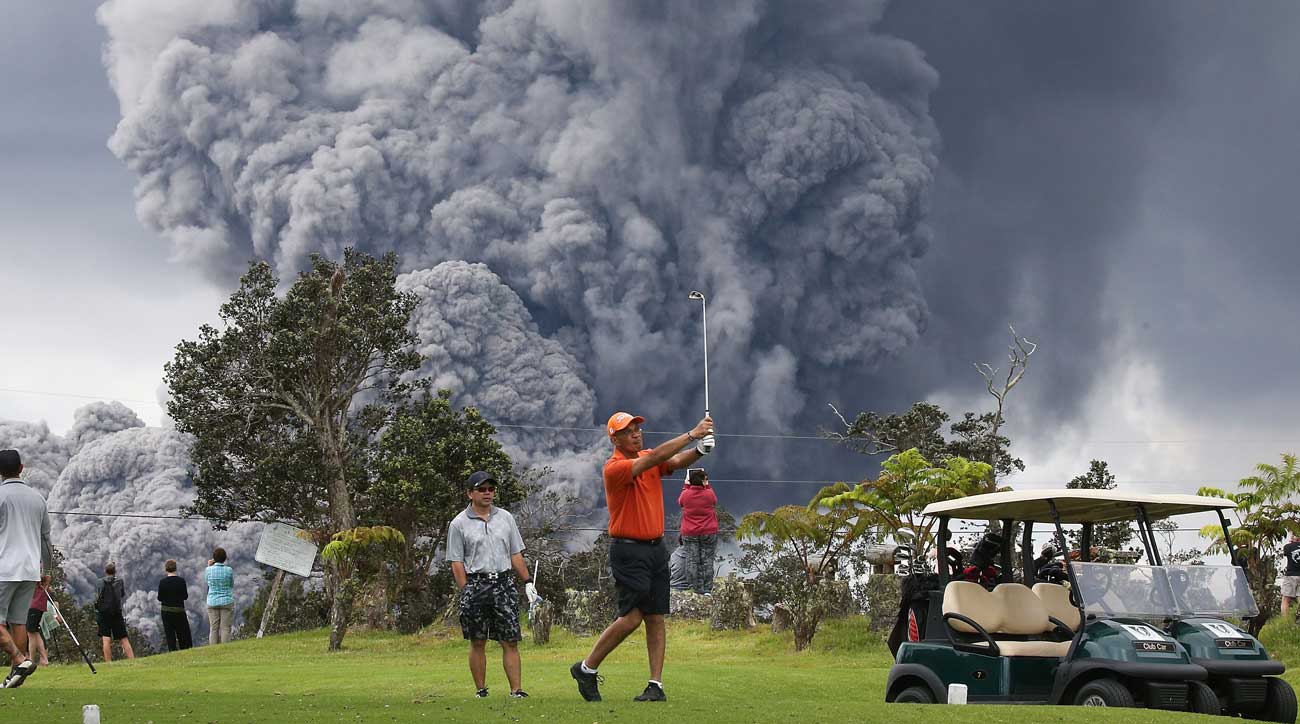 Golfers brave erupting volcano in Hawaii to sneak in a round: PHOTOS