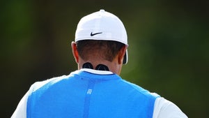 After waking up with a stiff neck, Tiger Woods applied KT Tape for his first round at Carnoustie.