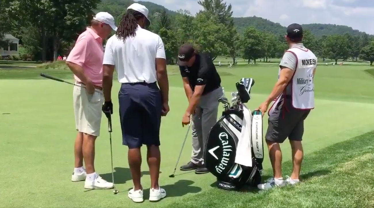 Phil Mickelson gives NFL star Larry Fitzgerald an impromptu chipping lesson, Tips from the short game legend himself. Phil Mickelson gives an  impromptu chipping lesson to NFL star Larry Fitzgerald.