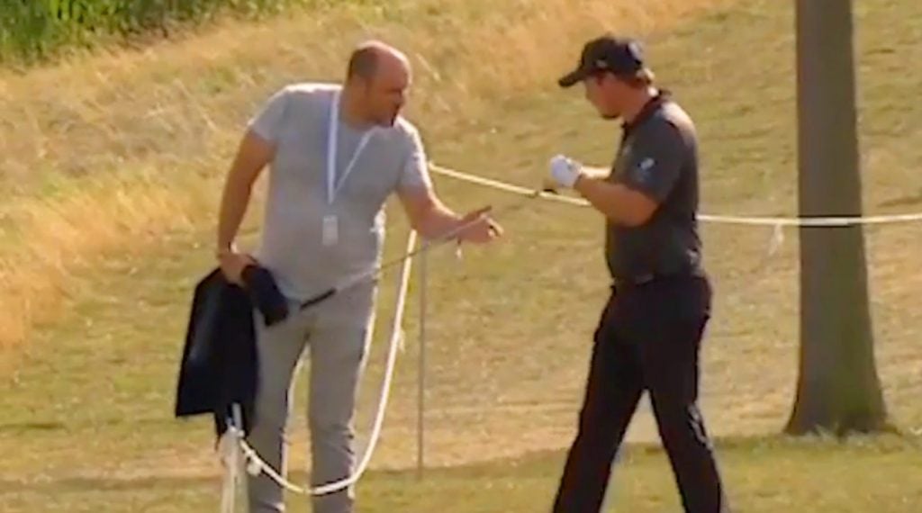 Eddie Pepperell gives his lob wedge to a fan Sunday at the Czech Masters.