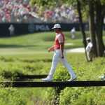 Gary Woodland and Kevin Kisner are in prime position halfway through the 100th PGA Championship.