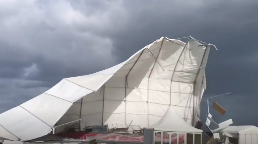 Wind lifts a hospitality tent into the air at St. Andrews.