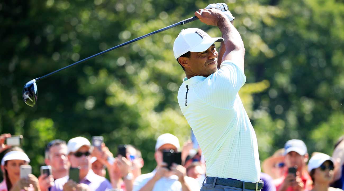 Tiger Woods shoots first nine 29, races into first round lead at BMW