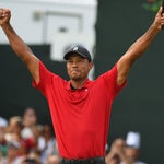 Woods celebrates after Tour victory No. 80.