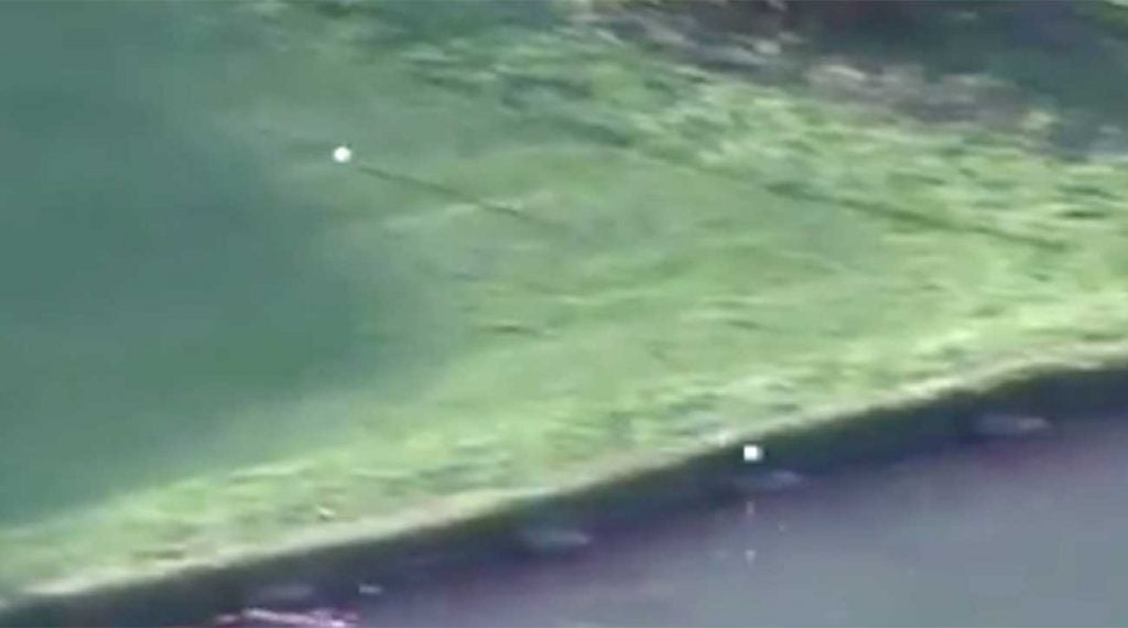 The golf balls of Justin Rose and Xander Schauffele dash into the water on Sunday in China.