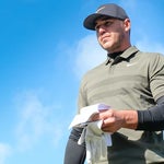 Brooks Koepka walks down the fairway.