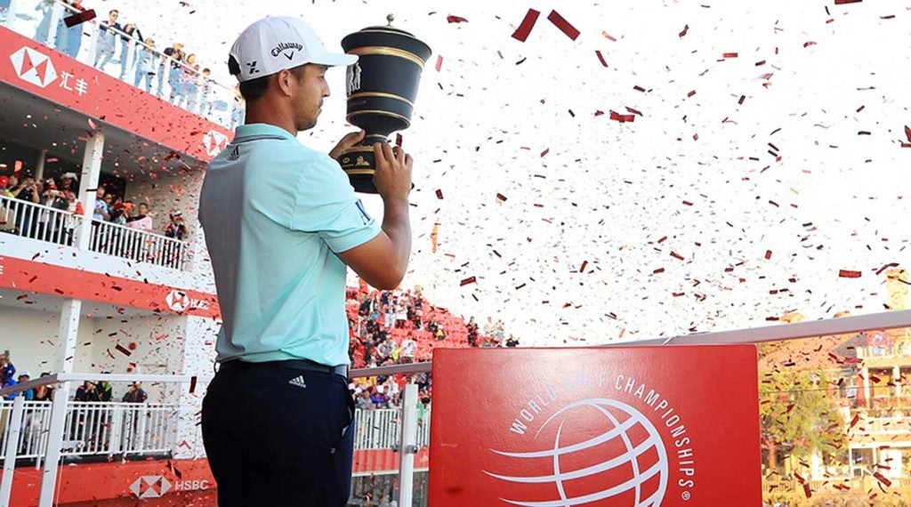 Xander Schauffele holds up the trophy after winning the WGC-HSBC Champions.