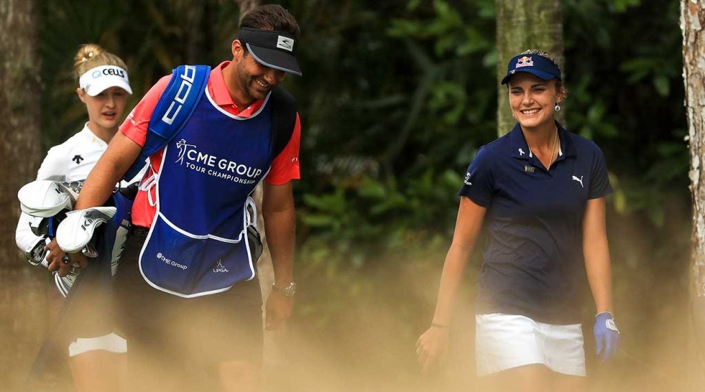 Lexi Thompson and her brother and caddie walk off the tee on Sunday.