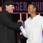 Tiger Woods and Phil Mickelson shakes hands during the afterparty for The Match.