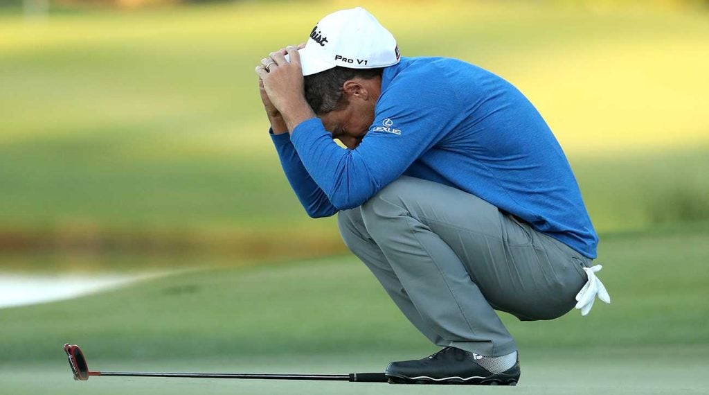 Charles Howell III crouches after making birdie to win the RSM Classic on Sunday.