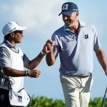 Matt Kuchar and his local caddie, David, celebrate a shot during the Mayakoba.