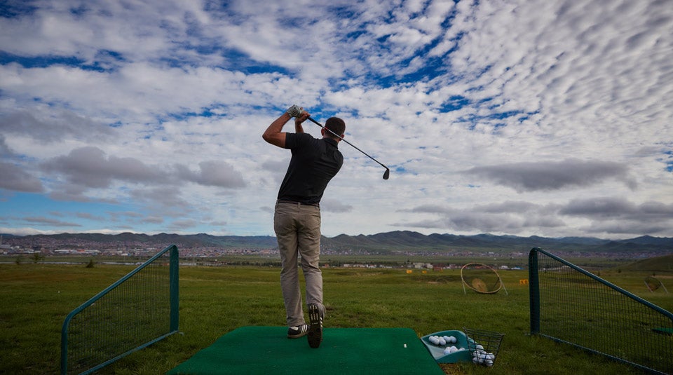 The author warming up on the Mt. Bogd driving range before the opening round of the Mongolian National Open. 