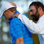 Caddie Michael Greller consoles Jordan Spieth after the 2016 Masters.