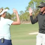 Lexi Thompson and TOny Finau high-five after competing against each other prior to the QBE Shootout.