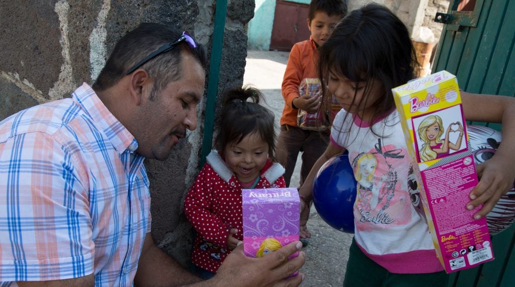 As part of his annual toy drive, Camaron hands out toys to children in the rural village of La Caja, just outside Irapuato.