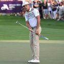 Bryson DeChambeau putts with the pin in during the Omega Dubai Desert Classic.