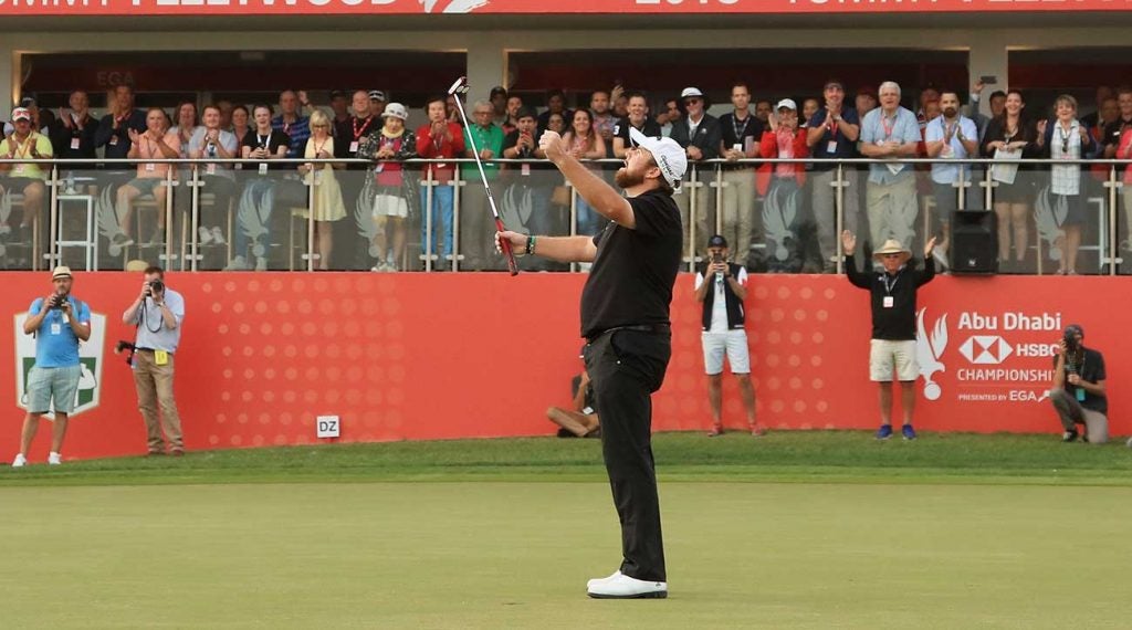 Shane Lowry raises his arms after making birdie to win the Abu Dhabi HSBC Championship.