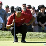 Tiger Woods reads a putt during the 2018 Farmers Insurance Open.