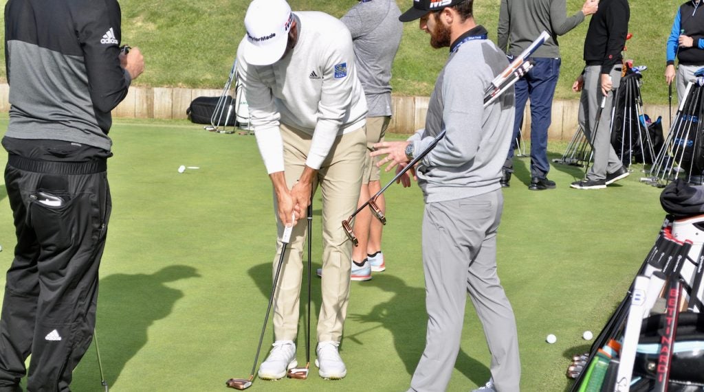 Dustin Johnson and TaylorMade Tour rep Chris Trott discuss Spider Tour putters.
