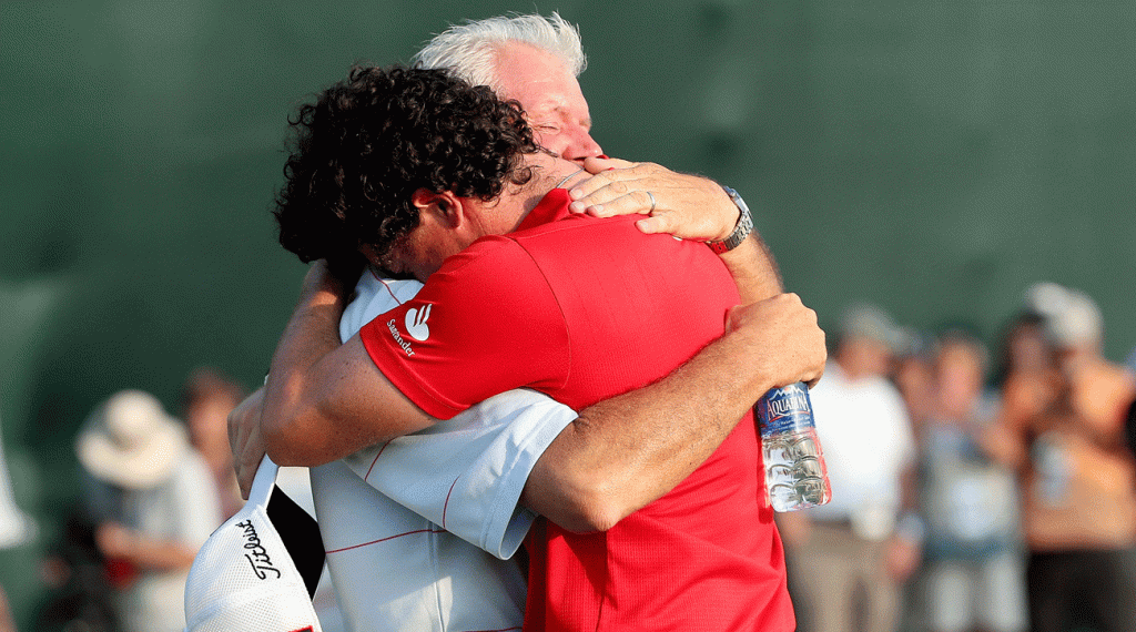 Rory and Gerry McIlroy hug it out.