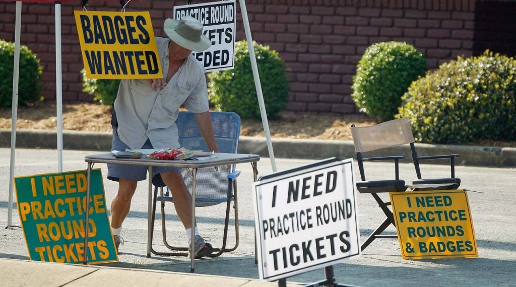 Tickets scalpers look for badges along Washington Road in front of Augusta National before the 2018 Masters