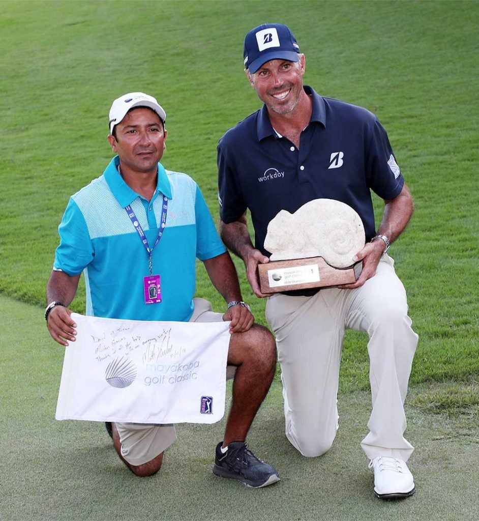 Kuchar and El Tucan pose with the winning trophy.