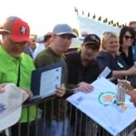 Phil Mickelson signs a woman's high heels after his first round at the 2019 Waste Management Phoenix Open.