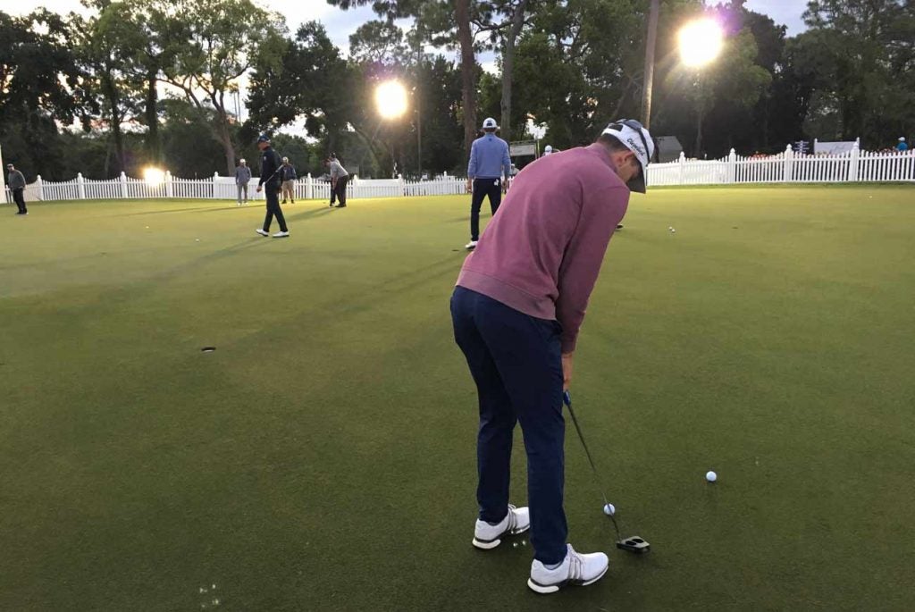 Martin Trainer putting under the floodlights just after 7 a.m.