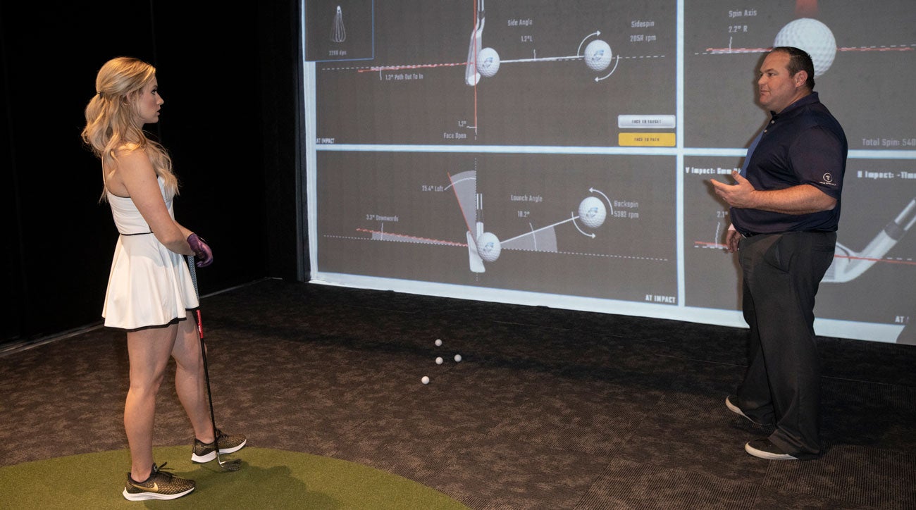 After selecting her putter, Paige moved on to irons.