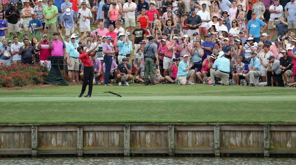 Last year, Tiger Woods hit wedge off No. 17 - and dumped it in the water.