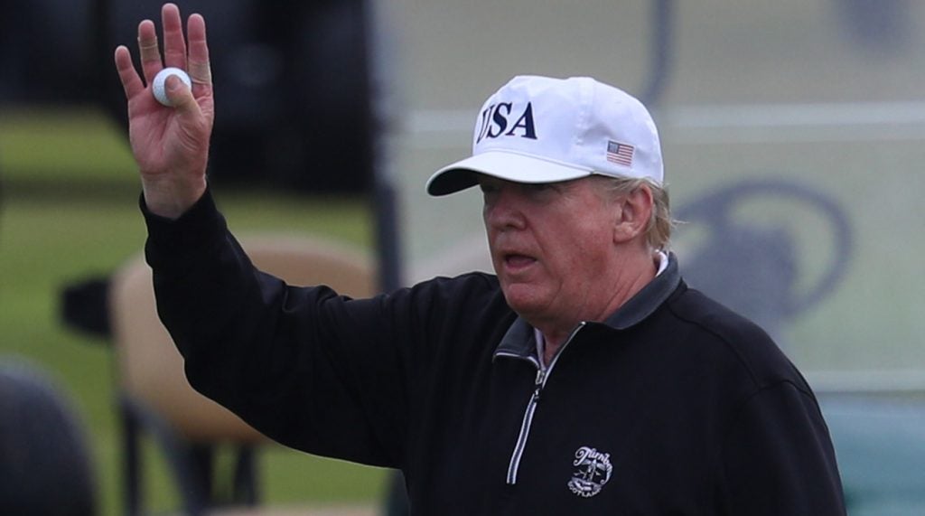 Donlad Trump plays golf during a recent visit to his course in Scotland