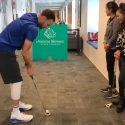 Steph Curry takes his shot during a putting contest with Augusta National Women's Amateur players