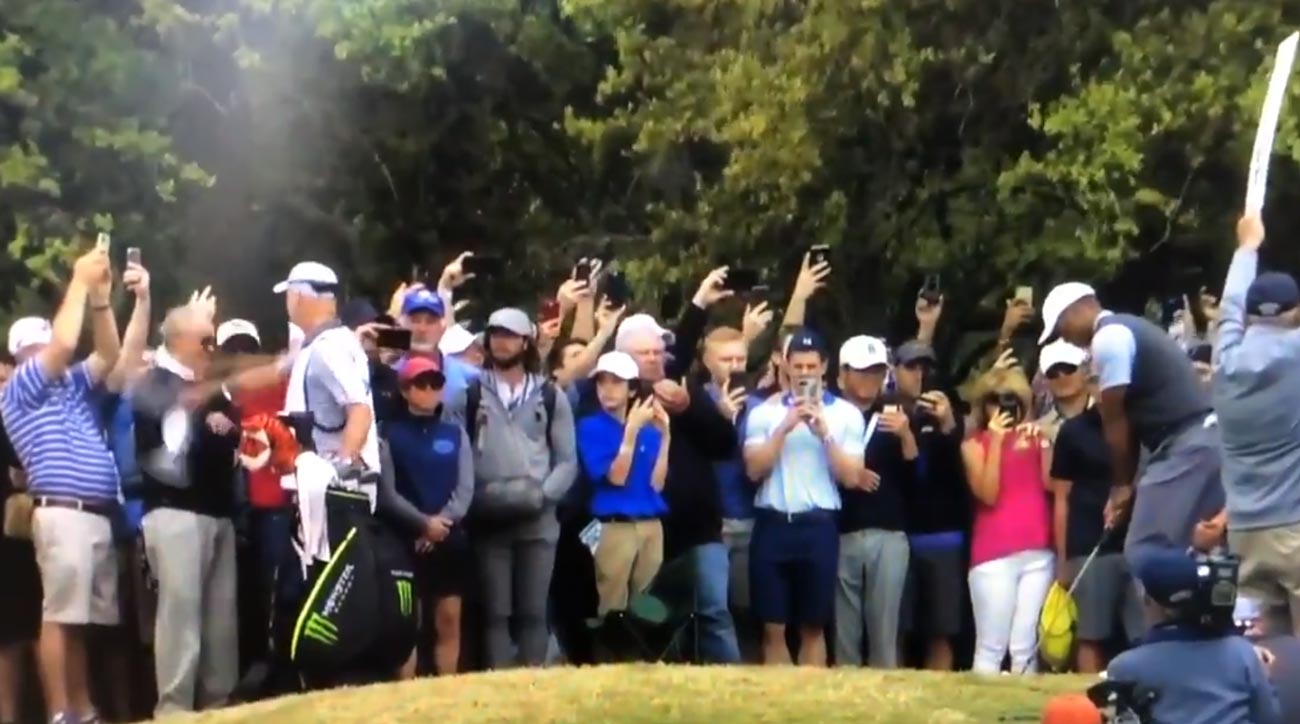 Tiger Woods caddie Joe LaCava rips hat off fan's head