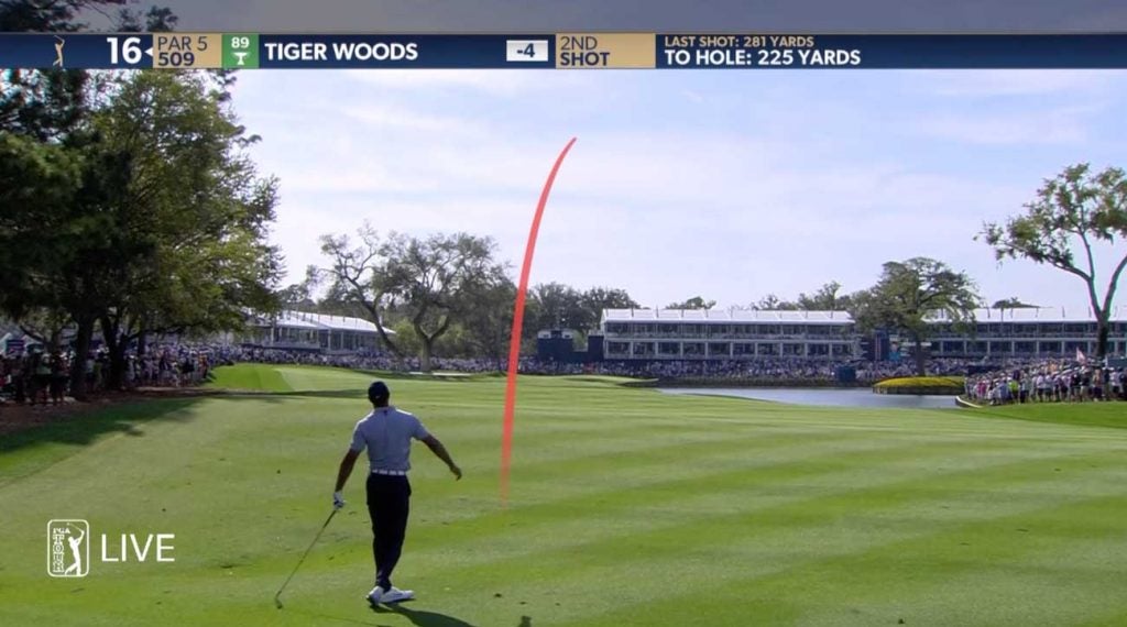 Luckily, Woods caught some turf and not the hazard.