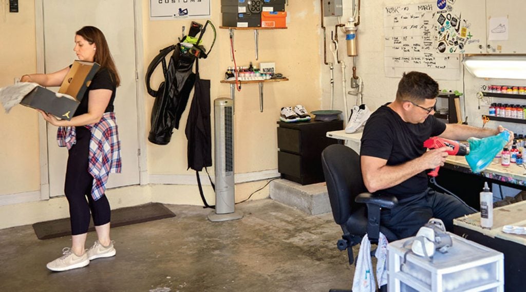 Roly Padron working out of his garage.