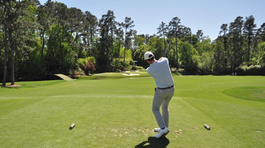 Jonathan Wall tees off on the iconic par-3 12th. 