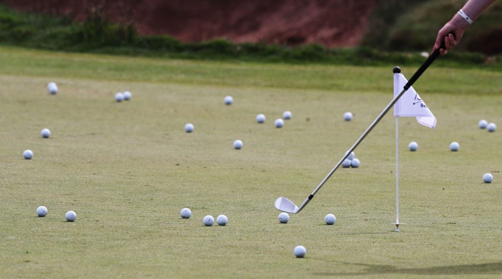 Don't bother touching those little flags on the practice green.