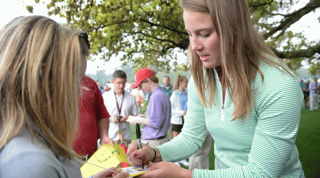 Jennifer Kupcho signs an autograph for an adoring fan at the Drive, Chip & Putt Championship at Augusta National.