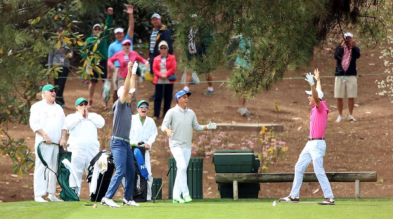 Rickie Fower, Justin Thomas and Jordan Spieth celebrate a Masters Par-3 ace.