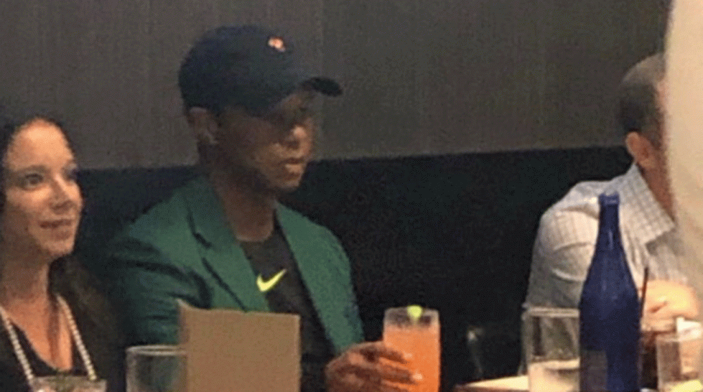 Tiger Woods was spotted wearing the green jacket Friday evening with his girlfriend Erica Herman.