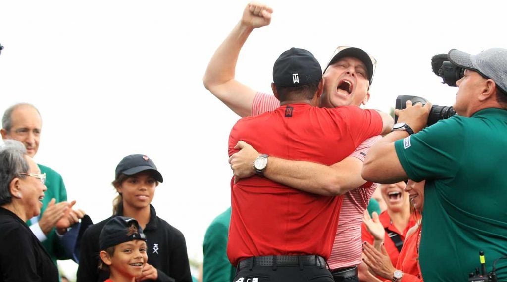 Tiger Woods and Rob McNamara shared a moment behind the 18th green.