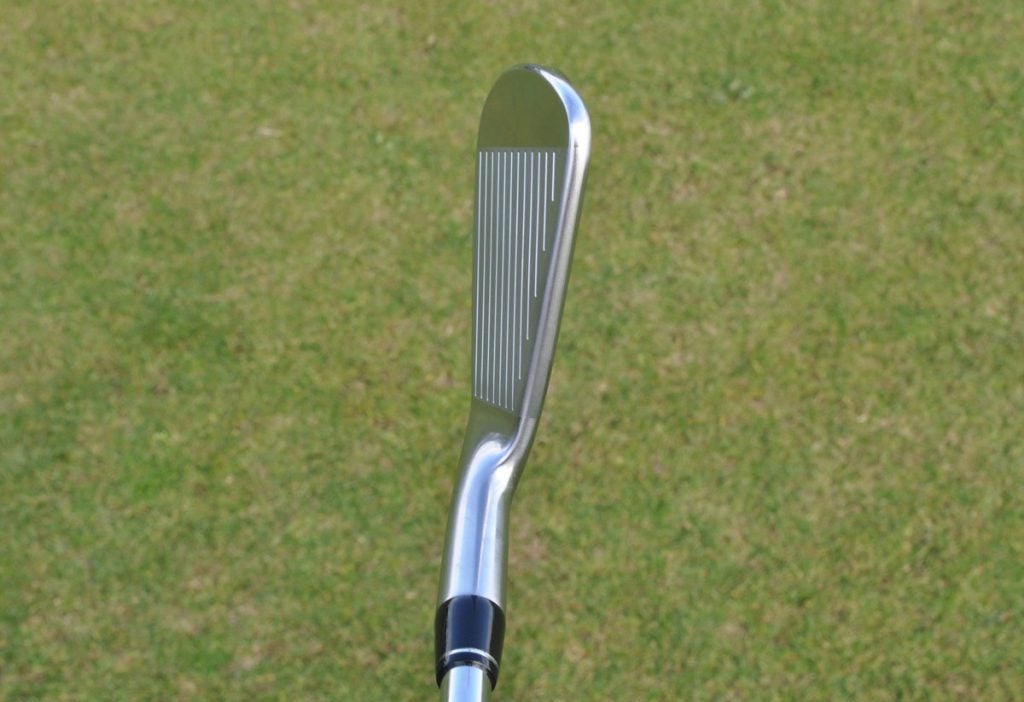 Titleist CP-02 iron at address.