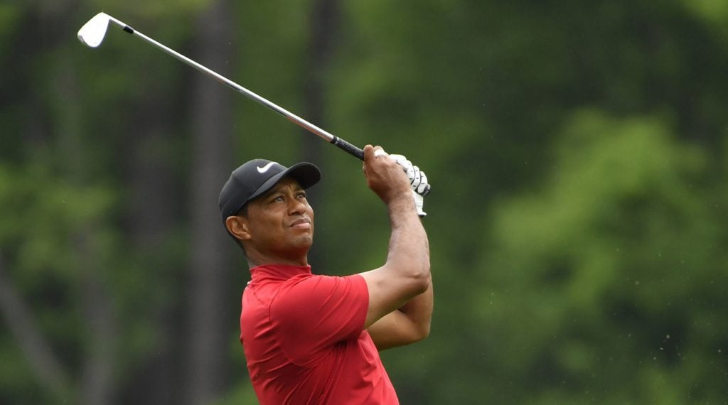 Tiger Woods nearly aced the 16th hole and then won his fifth Masters.