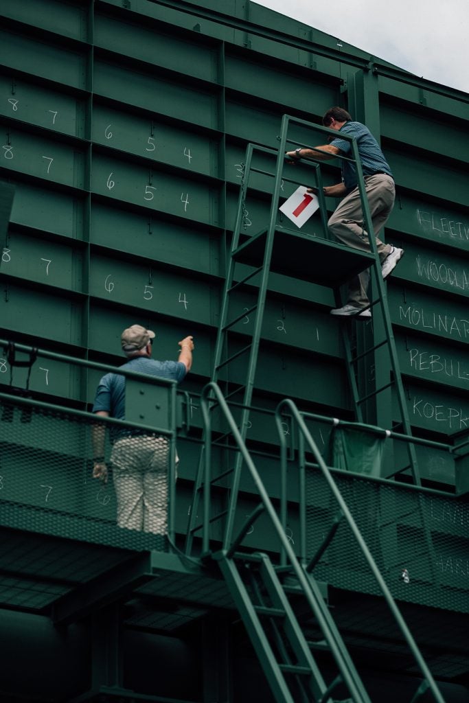 Nostalgia is part of what makes the Masters so beloved, and nothing is more nostalgic than its leaderboards, which are operated by hand in teams of two or three. Notice the names written in chalk to the far right.