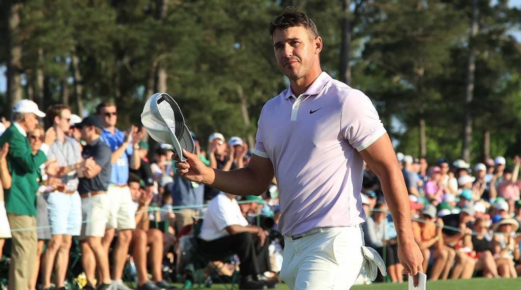 Brooks Koepka walks off the green after his Masters round on Saturday. Koepka is three off the lead with 18 holes to play.