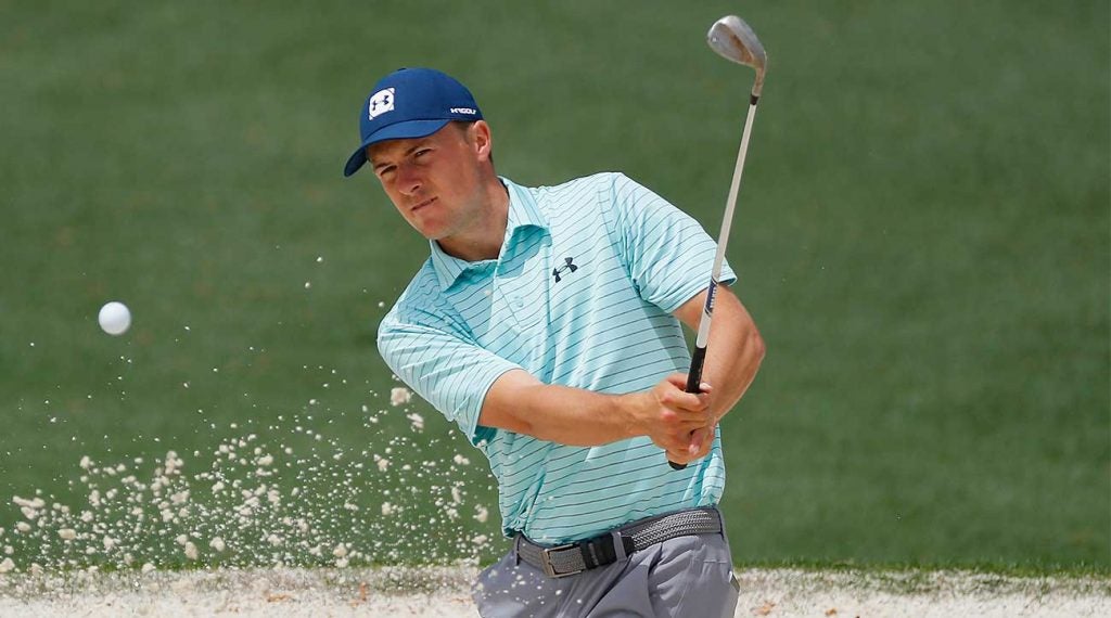 Jordan Spieth blasts out of a bunker during a practice round at the Masters.
