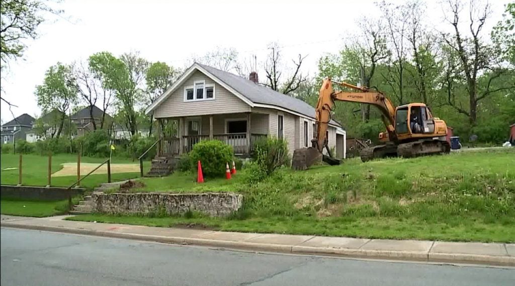The home where Harris grew up being demolished.